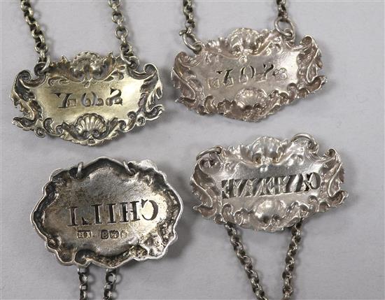 Four George III and later silver sauce labels;